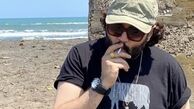 سیگار کشیدن مهران رنجبر لب ساحل + عکس