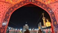 اهتزاز پرچم عزای علوی بر روی گنبد حرم مطهر رضوی