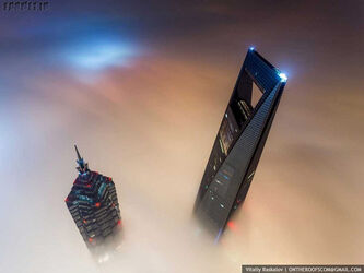 the-stunt-took-them-a-total-of-20-hours-since-they-entered-the-tower-at-night-scaled-the-crane-during-daybreak-and-waited-for-the-light-to-rise-to-capture-dream-like-views-of-the-neighboring-jin-mao-to1